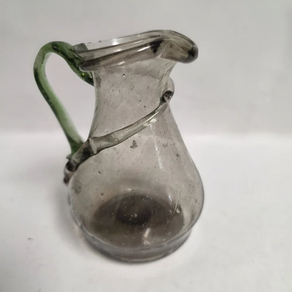 Hand Blown Art Glass Mini Pitcher Smoky Gray Seed Glass Applied Green Handle 6